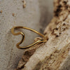 Gold ring on a textured stone surface