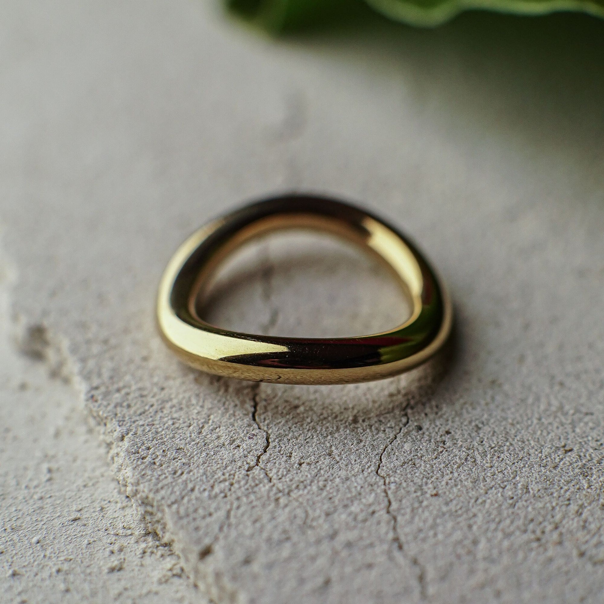 Gold ring on a textured surface