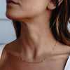 Model is wearing Dorota Zirconia Gold Necklace