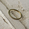 Gold ring on a sandy surface