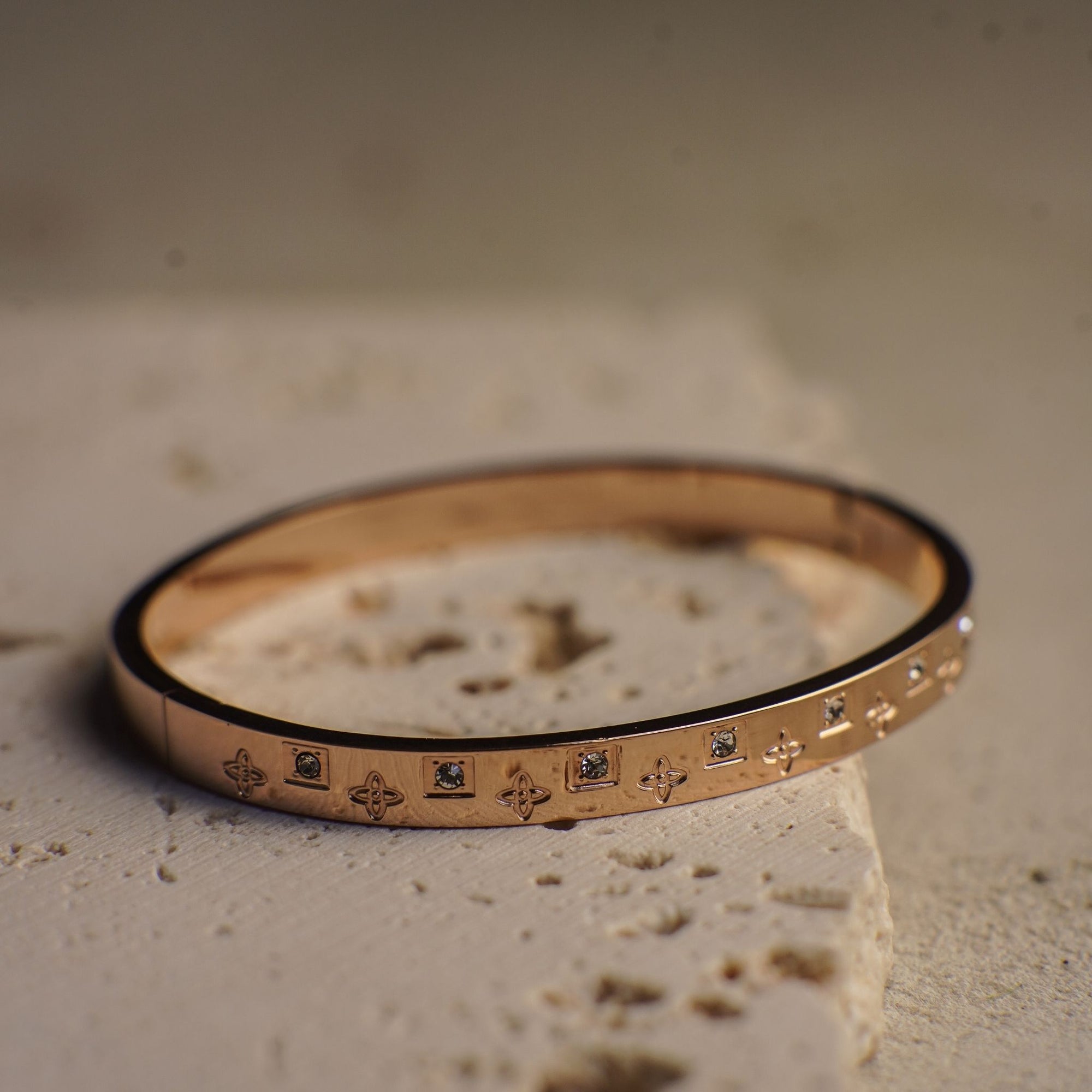 Bracelet with decorative elements on a textured surface