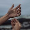 Fabiana Gold Necklace on a model's hand