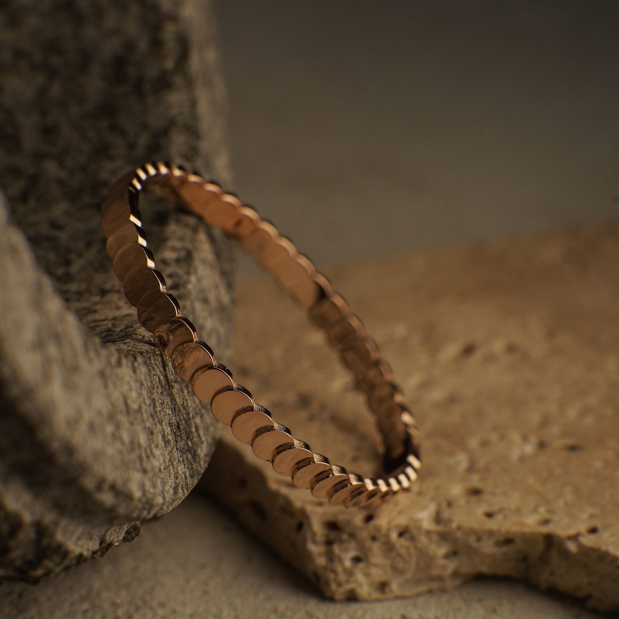Brown beaded bracelet on a textured surface