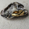 Gold ring on a textured surface