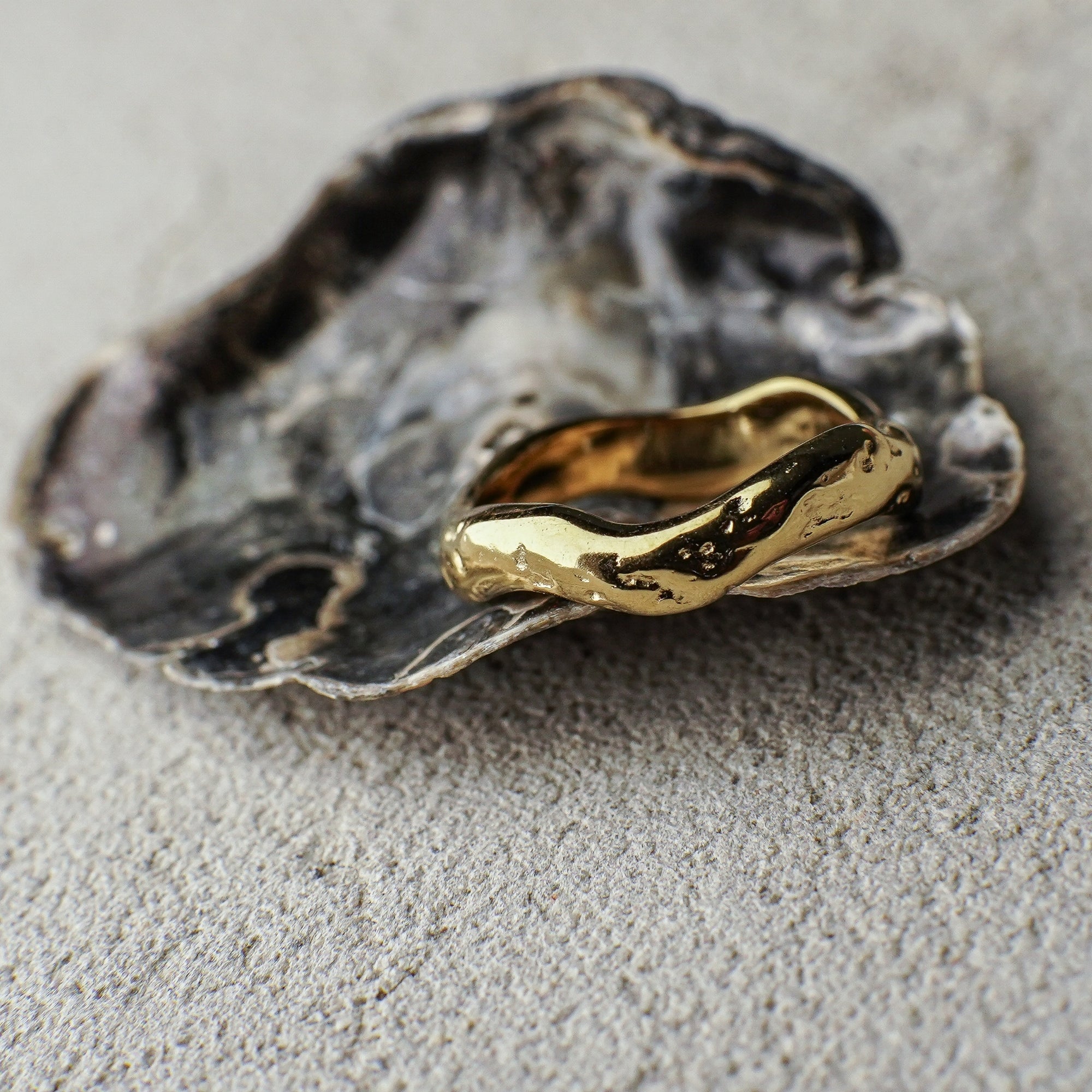 Gold ring on a textured surface