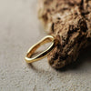 Gold ring on a textured surface