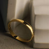 Gold ring on a textured surface