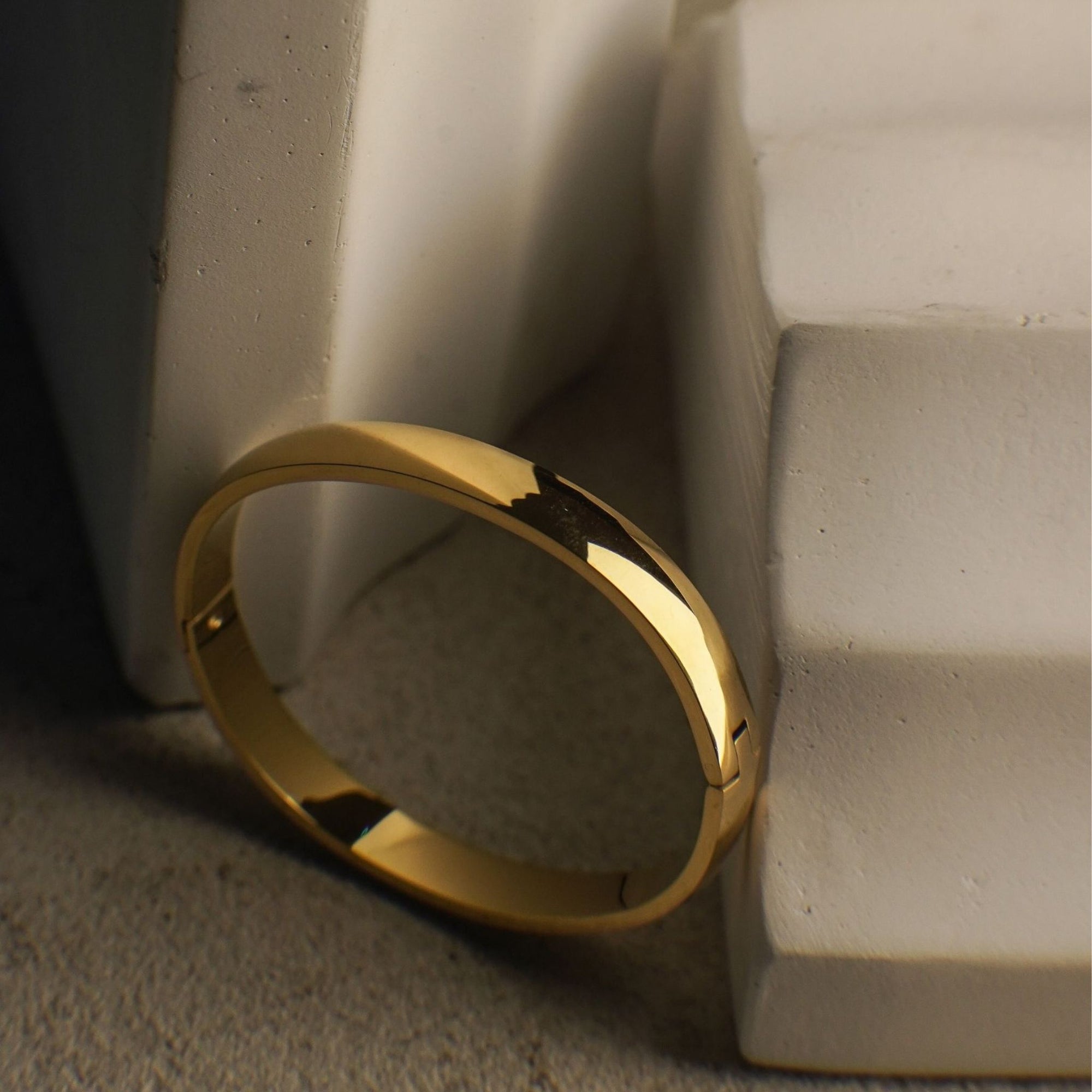 Gold ring on a textured surface